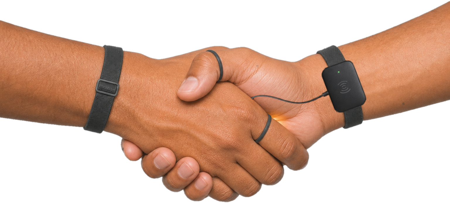 Two pilgrims shaking hands wearing the SalamLink wearable, triggering a translation session